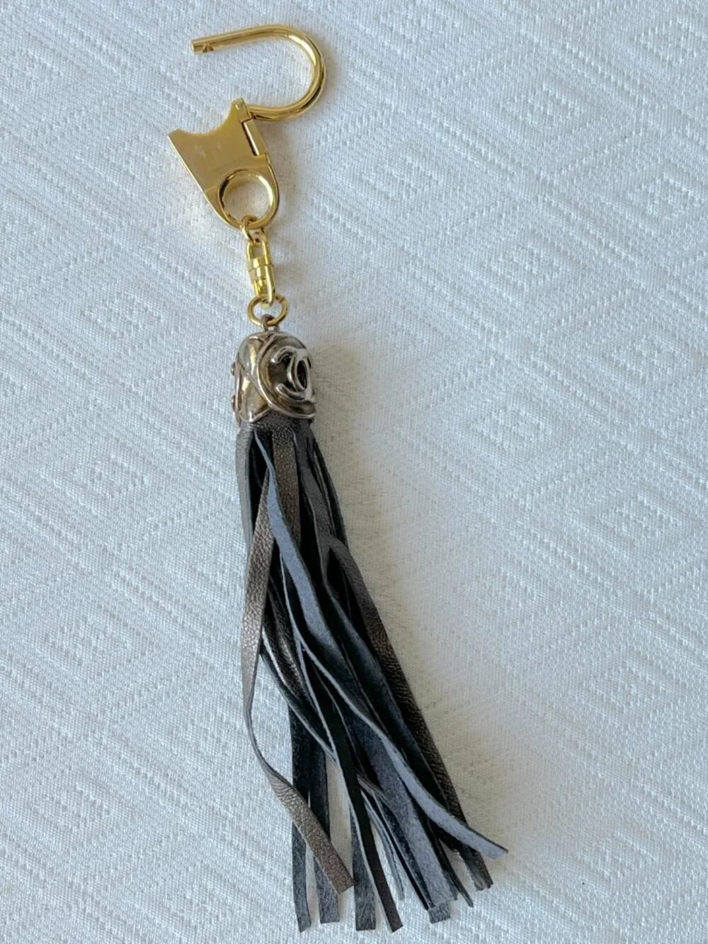 CC keychain gold with bronze leather fringe vintage